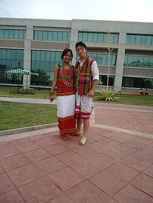 Tripuri couple in traditional attire The traditional Tripuri attire. The girl is seen here wearing a "Rigwnai" or more specifically "Chamathwi baar".jpg