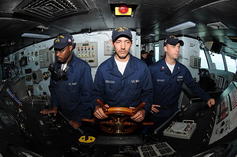 File:US Navy 090716-N-7456N-032 Boatswain's Mate Seaman Austin Romero, middle, steers USS Carl Vinson (CVN 70) as helmsman while Boatswain's Mate Seaman Reginald Thorton, left, and Boatswain's Mate 2nd Class Jonathan Beesley man the.jpg