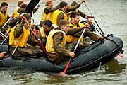 Defense.gov News Photo 100518-N-2069B-319 - U.S. Naval Academy plebes paddle pontoon boats during a team-building portion of Sea Trials at the U.S. Naval Academy in Annapolis Md