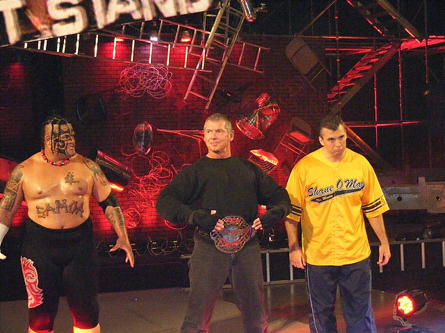 Umaga (left) at One Night Stand in June 2007 with Vince McMahon and Shane McMahon