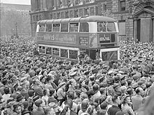 Double-decker bus slowly pushes its way through the huge crowds gathered in Whitehall to hear Churchill's Victory speech, 8 May 1945 Ve Day Celebrations in London, England, UK, 8 May 1945 D24587.jpg