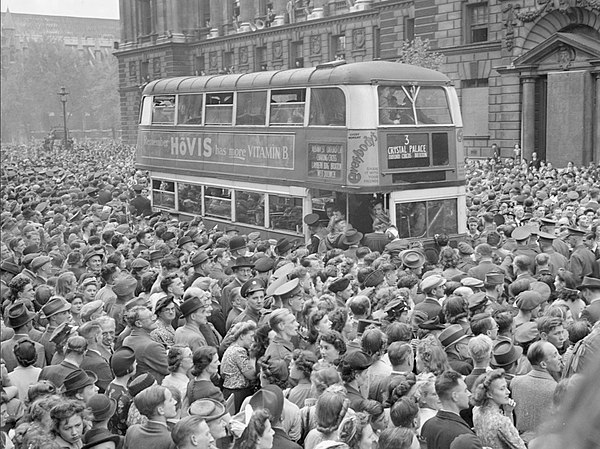 People gathered in Whitehall to hear Winston Churchill's victory speech and celebrate Victory in Europe, 8 May 1945