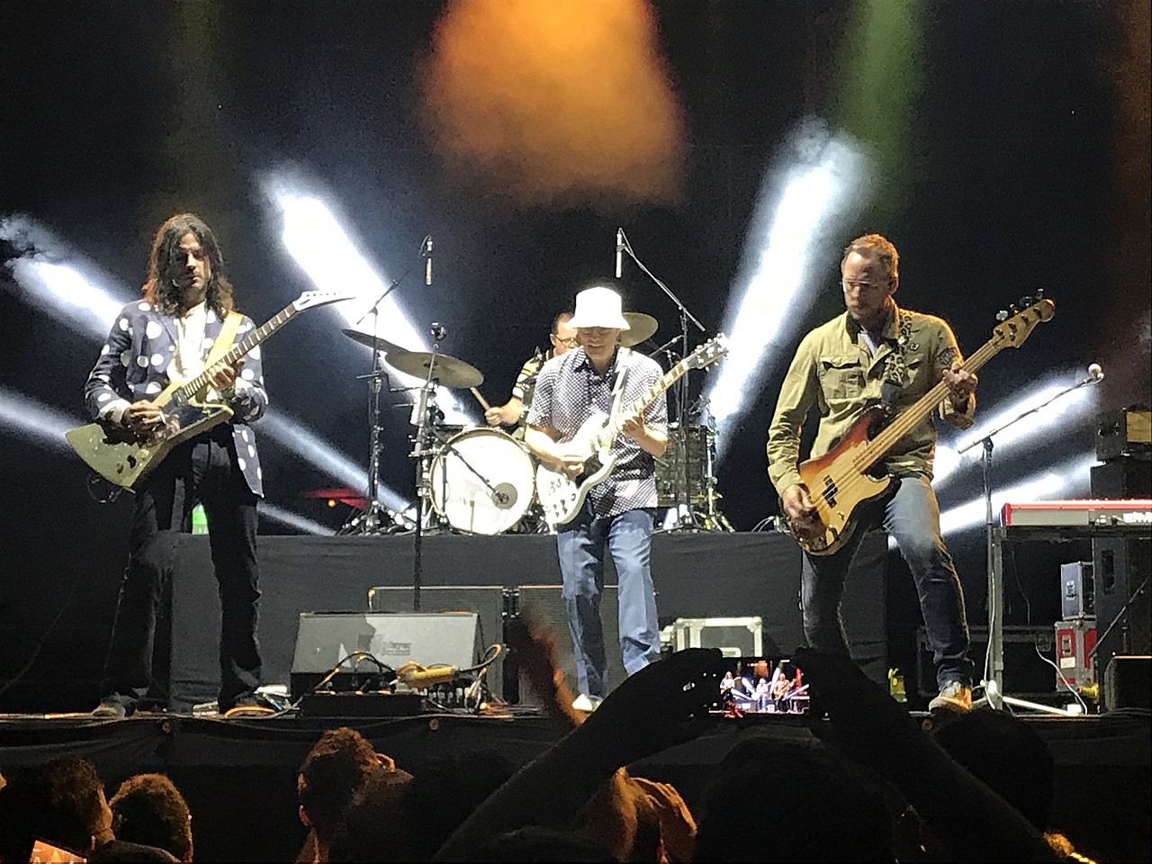 Weezer performing in 2019 at Musikfest in Bethlehem, Pennsylvania. From left to right: Brian Bell, Patrick Wilson, Rivers Cuomo, and Scott Shriner.