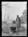 Wife of evicted sharecropper washing clothes. Butler County, Missouri LCCN2017779453.tif