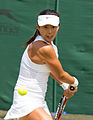 Yang Zhaoxuan competing in the third round of the 2015 Wimbledon Qualifying Tournament at the Bank of England Sports Grounds in Roehampton, England. The winners of three rounds of competition qualify for the main draw of Wimbledon the following week.