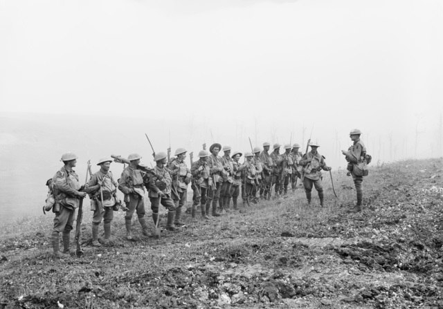 A platoon from the Australian 29th Battalion being addressed by their officer commanding in August 1918
