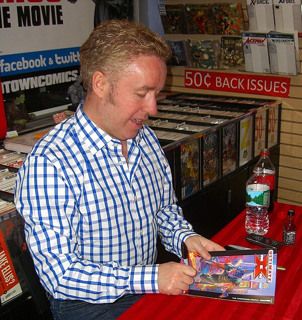 Writer Mark Millar signing a copy of the first issue during an appearance at Midtown Comics in Manhattan.