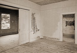 Interior view of a main floor room of the residential building, taken more than a century after the termination of the North American Phalanx 72-NorthAmericanPhalanx-interior.jpg