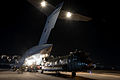 An RAF Chinook helicopter is loaded into a C-17 Globe master. MOD 45158743.jpg