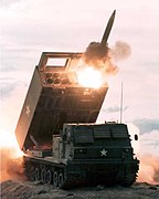 American M270 MLRS conducts a rocket launch.