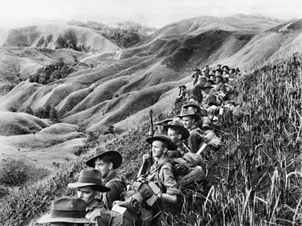 Australian soldiers resting in the Finisterre Ranges of New Guinea while en route to the front line