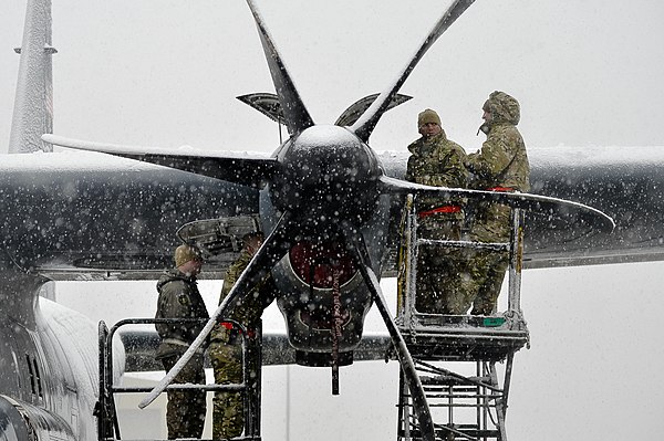 Maintenance squadron working on the engine of a C-130J Super Hercules, Bagram Air Base