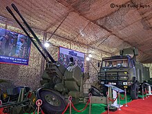 Bangladesh Army CS/AA3 35 mm twin anti-aircraft gun system along with its FW-2 fire control radar system behind. CS/AA3 is a Chinese variant of the Oerlikon GDF Bangladesh Army CS AA3 35 mm AA gun with the FW-2 fire control system on display.jpg