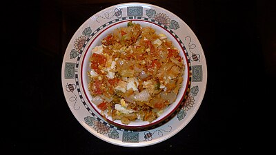 Buljol (gesalzener Kabeljau, Öl, Zwiebeln, Tomaten, Paprika, gekochte Eier)