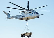 A CH-53K lifts a Joint Light Tactical Vehicle during a demonstration