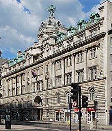 Electra House, 84 Moorgate, built by John Belcher in 1902, topped by a sculpture of young Atlases supporting a zodiacal globe by F.W. Pomeroy. Electra House.jpg