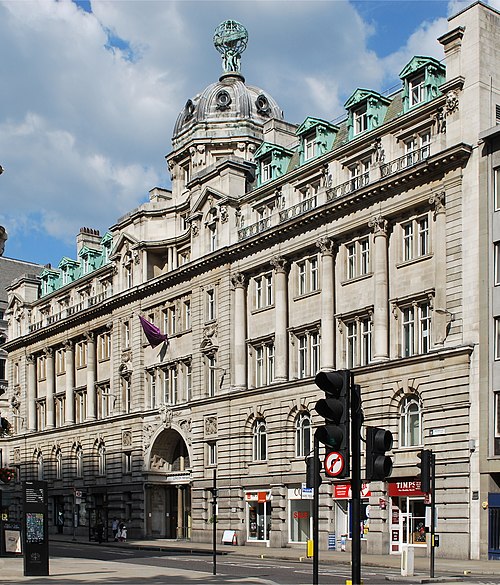 Electra House, 84 Moorgate, built by John Belcher in 1902, topped by a sculpture of young Atlases supporting a zodiacal globe by F.W. Pomeroy.