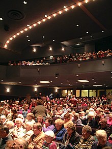 An audience gathers December 3, 2004 for the opening matinee of a refurbished Englert. Englert audience 12-3-2004 reopening matinee as civic theatre.JPG