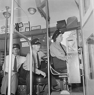 Esther Bubley photograph of a woman being taught to drive a streetcar in World War II.