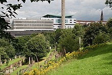 The New Buildings (post-1974) at the Glasgow Royal Infirmary, viewed from the Necropolis. The Queen Elizabeth Building, completed in 1981, is in the foreground. The newer Princess Royal Maternity Hospital, opened in 2001, is just behind and to the right. The University Teaching Block is on the left hand side, adjoining the 1981 building. Glasgow-necropolis-royalinfirmary.JPG