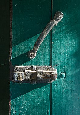 Handle and door latch on an exterior door