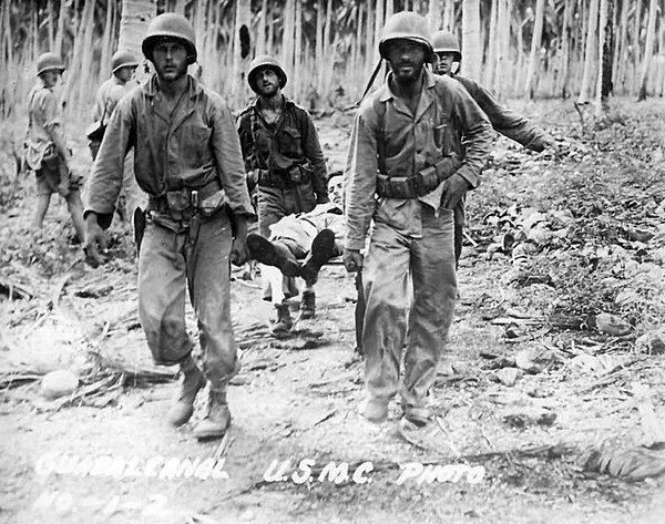 U.S. 5th Marines evacuate injured personnel during actions on Guadalcanal on November 1, 1942