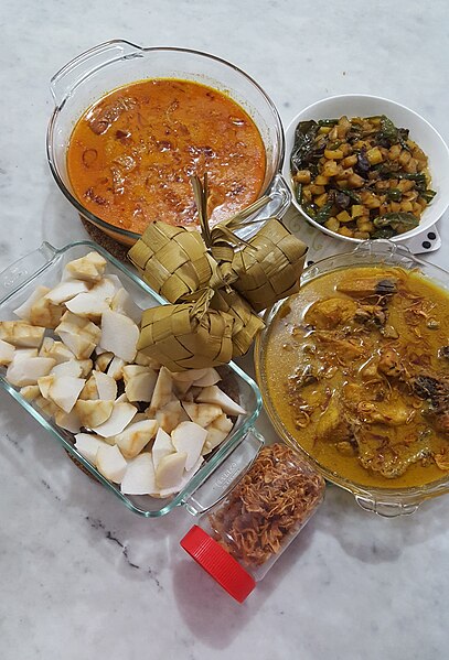Opor ayam (curry style), gulai, ketupat, diced potatoes with spices, and bawang goreng served during Lebaran (Eid al-Fitr) in Indonesia