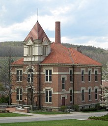 Originally built in 1884, Kanakadea Hall served as Alfred's schoolhouse until a large fire destroyed the tower and devastated the second floor in 1907. It was sold to Alfred University and repaired in 1908. The exterior has since been restored to its original appearance, although the interior has been fully modernized. The building now houses the Division of Human Studies. Kanakadea Hall at Alfred University.jpg