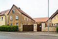 Three-sided courtyard with stable house (No. 22), barn, pull-out house (No. 20) and courtyard wall with gate entrance and courtyard paving