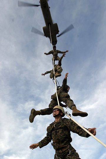Marine Raiders of 1st Marine Raider Battalion are lifted from the ground by a CH-46 Sea Knight helicopter during Special Purpose Insertion/Extraction rigging at Camp Margarita, Camp Pendleton.