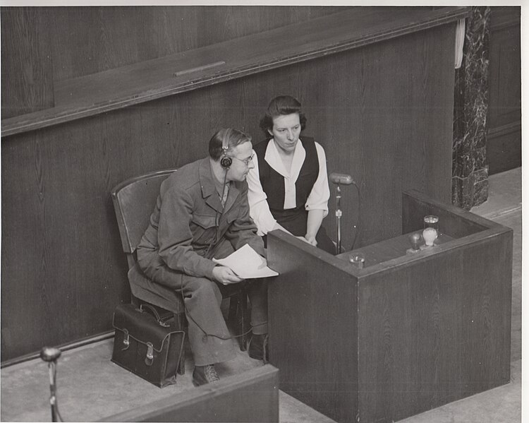 File:Marie Broel-Plater on witness stand in Doctors' Trial with Polish-English interpreter, Julius Panek.jpg