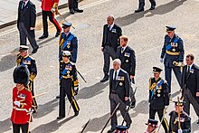 The King, the Princess Royal, the Duke of York, the Earl of Wessex, the Prince of Wales, the Duke of Sussex, Peter Phillips, the Earl of Snowdon and the Duke of Gloucester walk behind Queen Elizabeth II's coffin. Sir Timothy Laurence was also in the procession but is not seen in the photo. Queen Elizabeth II's Funeral and Procession (19.Sep.2022) - 07.jpg