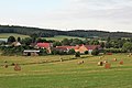 Čeština: Radějovice (okres Strakonice), v pozadí vrch Radovec English: Radějovice (Strakonice district), in the background is Radovec Hill in Netonice Highlands