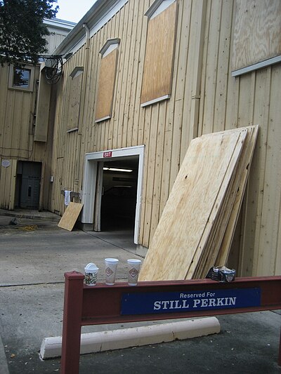 Windows of building in Uptown New Orleans being boarded up in preparation of a possible threat from Hurricane Gustav, August 28, 2008. RinkNOLAStillPerkinBoards.jpg