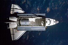 Top view of Atlantis prior to docking. STS135 nadir view of Atlantis prior to docking.jpg