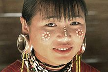A Karen woman from Burma with traditional ear plugs Thai Earplug 5.jpg