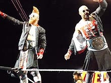 One-time champions The Bar (Sheamus and Cesaro) with the original design of the title when it was known as the SmackDown Tag Team Championship (2016-2024). The Bar - Cesaro & Sheamus - 2019-01-20 - 01.jpg