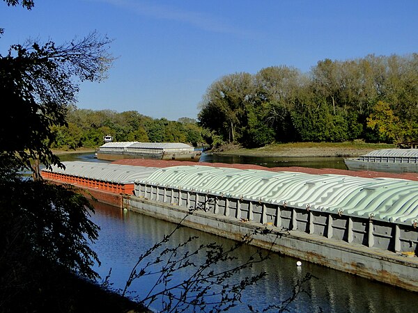 The towboat J.L. Fleming brings empty grain barges into Port Cargill on the Minnesota River, a tributary of the Mississippi River.