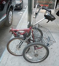 Small folded delta trike parked in New York Tri-Fecta folded trike jeh.jpg