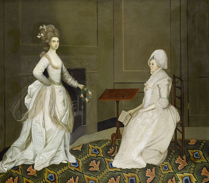 File:Two ladies in an interior one reading the other holding a garland of flowers.jpg