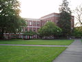 Front view of the original and new parts of Condon Hall, on the University of Oregon campus in Eugene, Oregon.