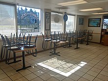 Interior of Vancouver, Washington restaurant open for takeout only on March 16 Undeployed chairs in a Vancouver restaurant, March 2020.jpg