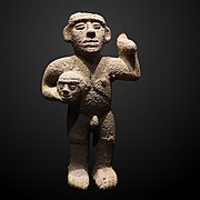 Warrior holding a severed head-ETHAM 023285