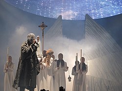 West performing as part of the tour, with LED screen and mountain visible in background. Yeezus tour.jpg