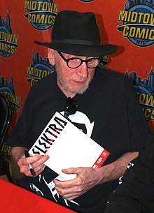 Frank Miller signing a copy of the Elektra comics series during an appearance at Midtown Comics