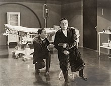 A still from the 1922 horror film A Blind Bargain with McKee (right) and Lon Chaney as The Hunchback.