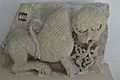 A stone sculpture of an animal resembling a lion