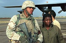 Army Spc. Shoshana Johnson returning to Kuwait City, Kuwait after her rescue, April 2003 Army Spc Shoshana Johnson' Return to Kuwait City, April 2003.jpg