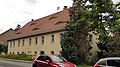 Three-sided courtyard with house, barn, side building and enclosure wall