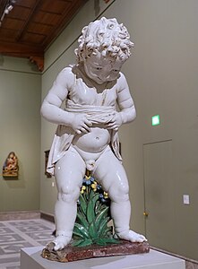 A glazed terracotta statue of a puer mingens, Andrea della Robbia, c. 1490, Bode Museum, Berlin